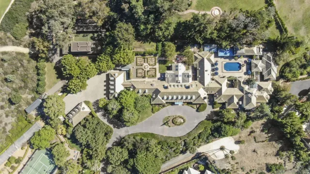 front view of a house with a potted plant