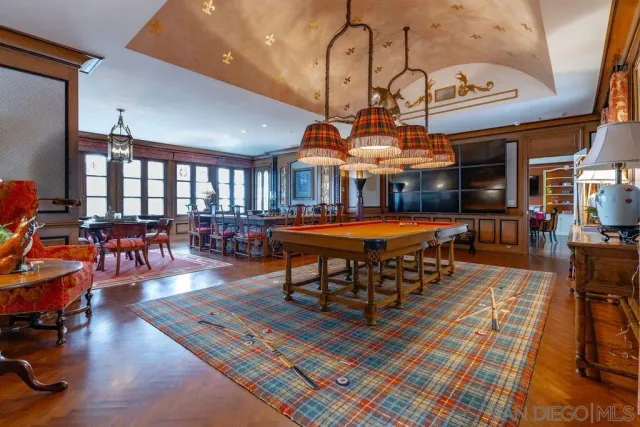 a bedroom with two beds and a window