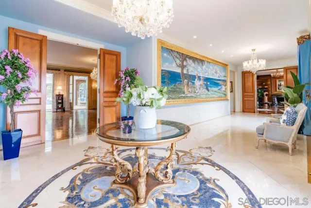 an aerial view of a house with yard swimming pool and mountain view