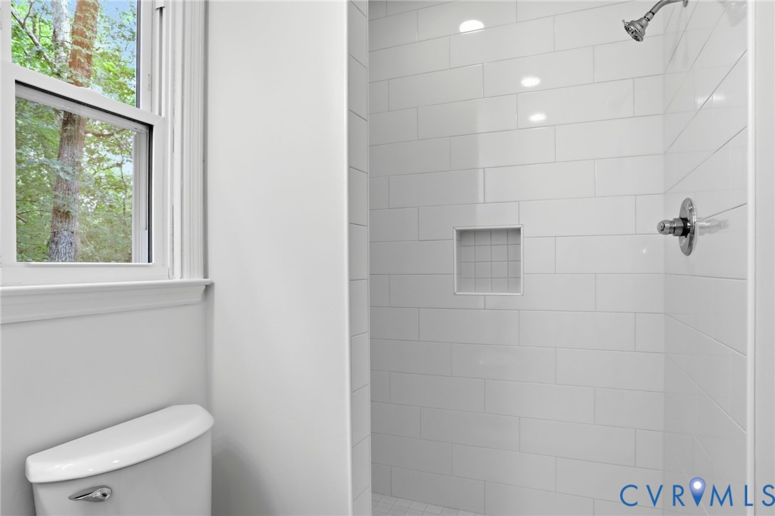 13913 Barnes Spring Road Midlothian, VA 23112 - Photo 25 of 51 Walk-in shower featuring white subway tile, a rece