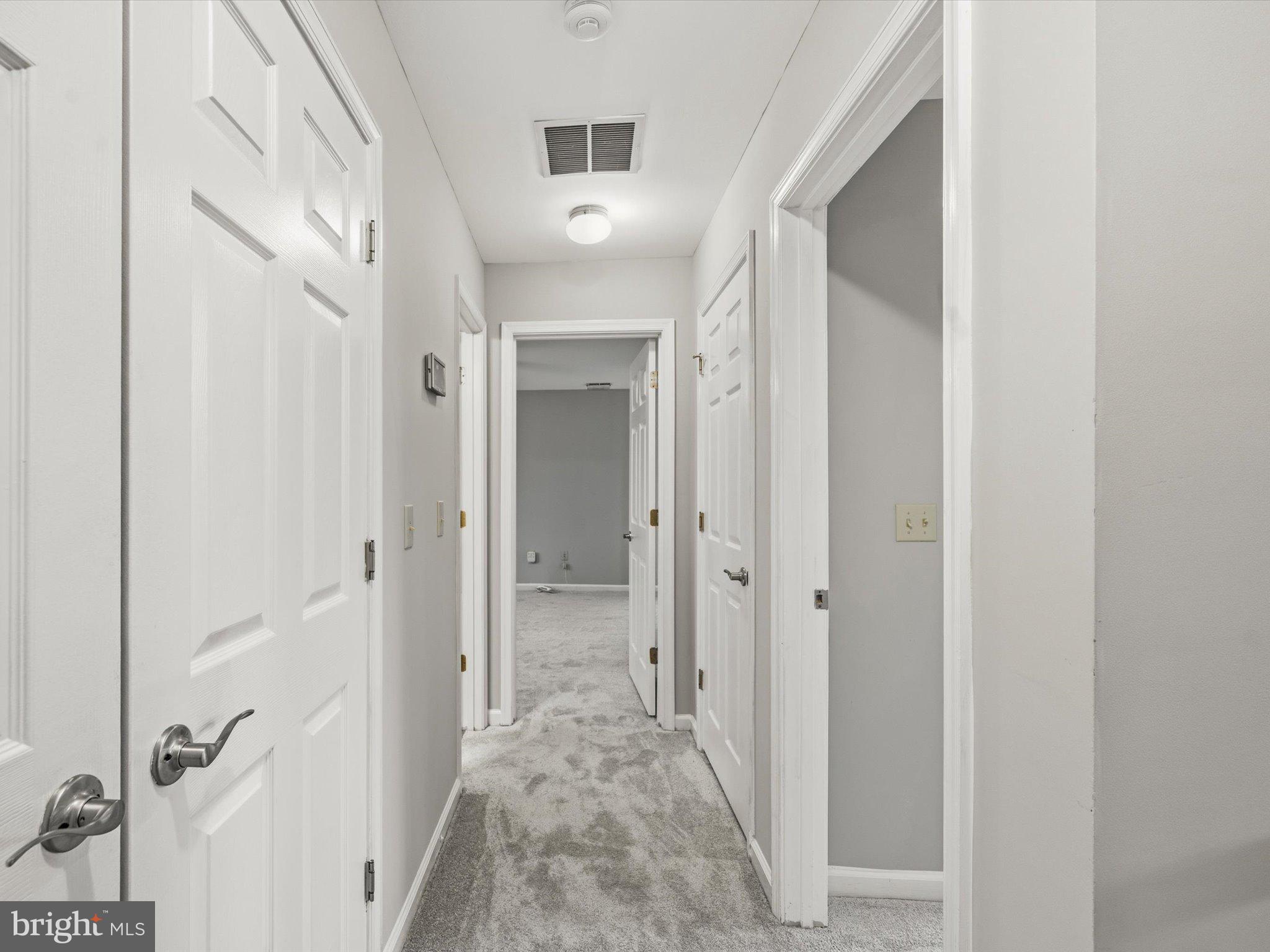 63 Hackberry Circle Shepherdstown, WV 25443 - Photo 30 of 55 Hallway with laundry convenient to bedrooms.
