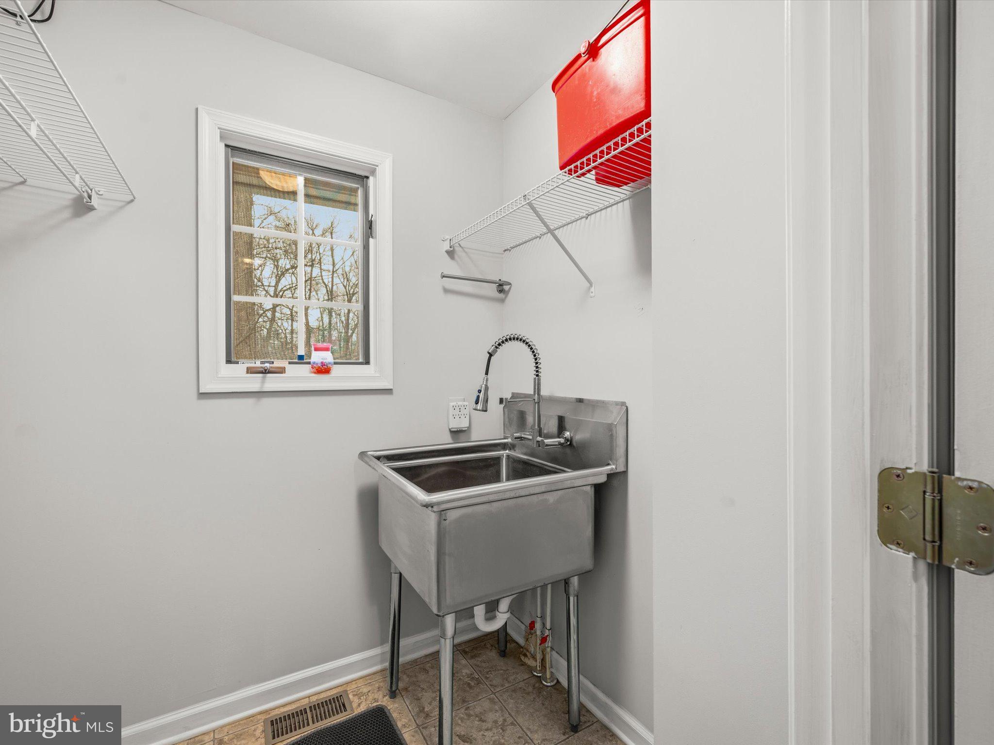 63 Hackberry Circle Shepherdstown, WV 25443 - Photo 50 of 55 Convenient! Utility Room by garage door entry.