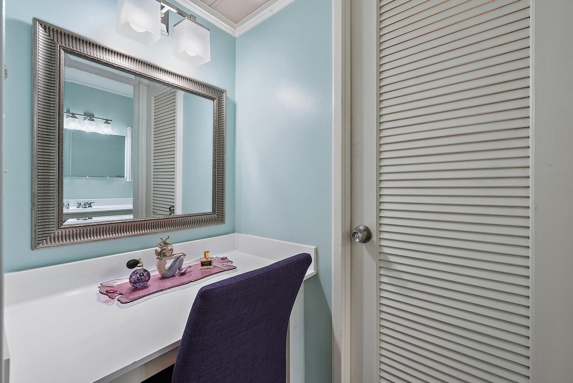 1561 Northeast 12th Terrace, Unit C14 Jensen Beach, FL 34957 - Photo 14 of 38 a bathroom with a sink and a mirror