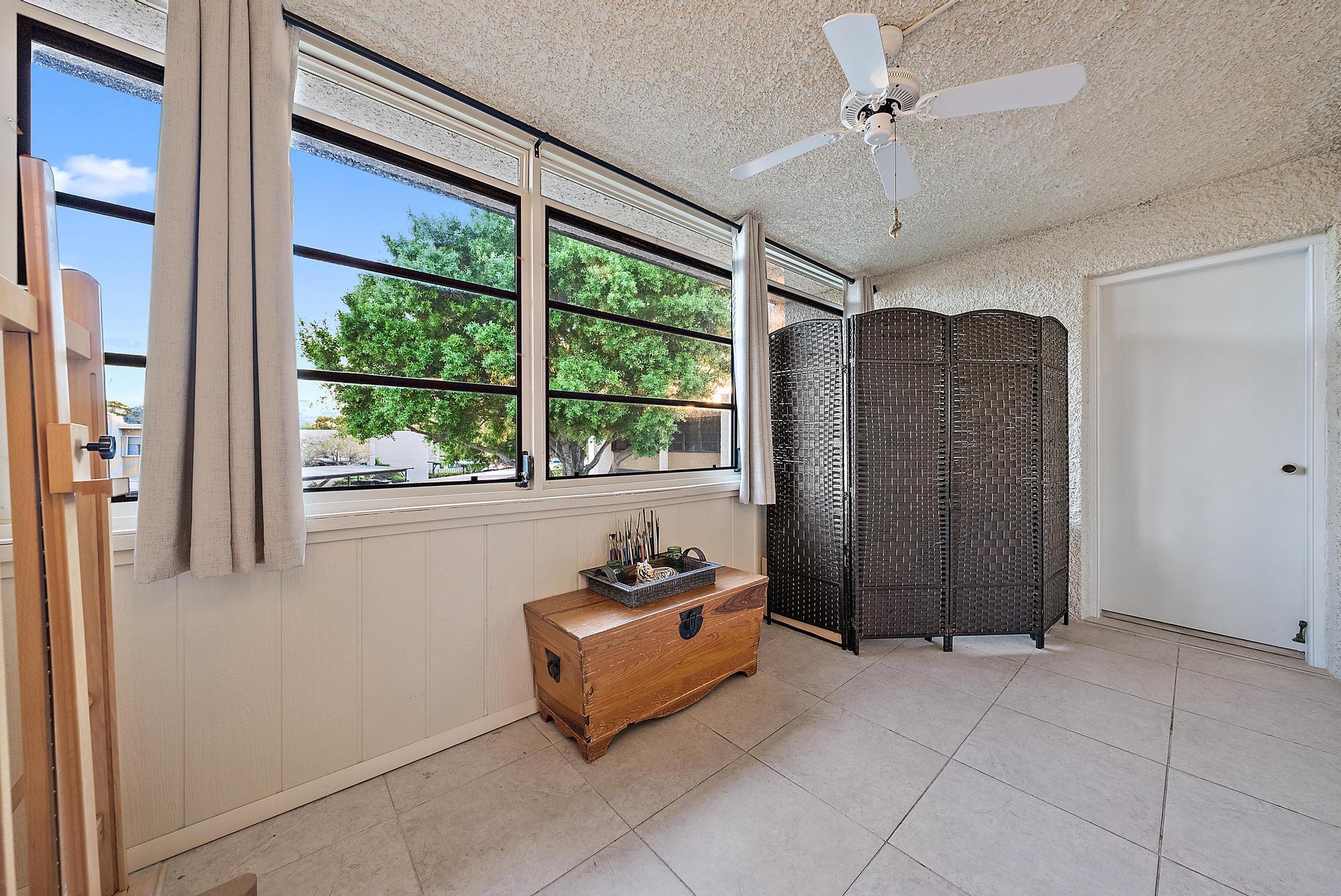 1561 Northeast 12th Terrace, Unit C14 Jensen Beach, FL 34957 - Photo 18 of 38 a view of entryway with furniture and a window