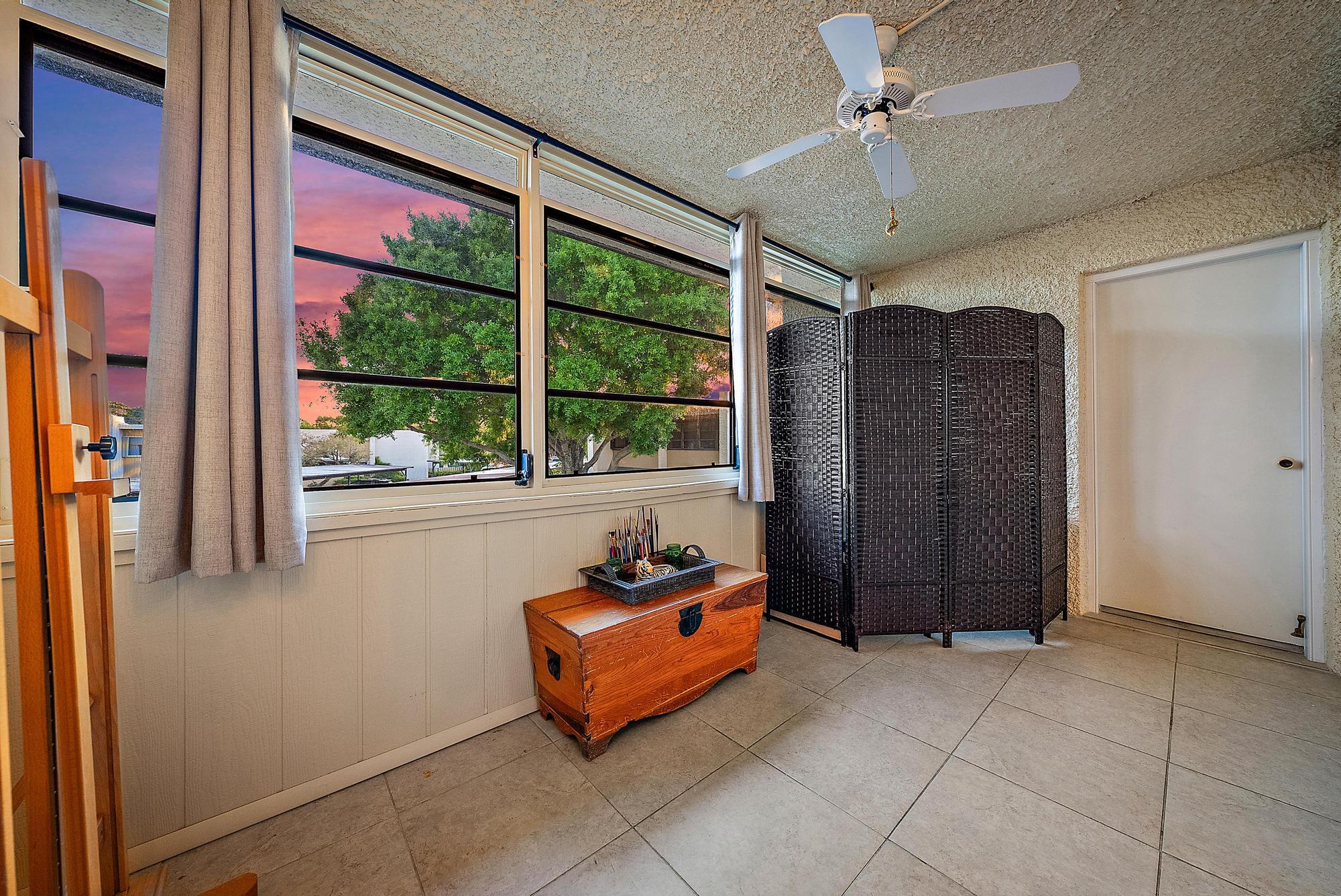 1561 Northeast 12th Terrace, Unit C14 Jensen Beach, FL 34957 - Photo 19 of 38 a living room with furniture and a window