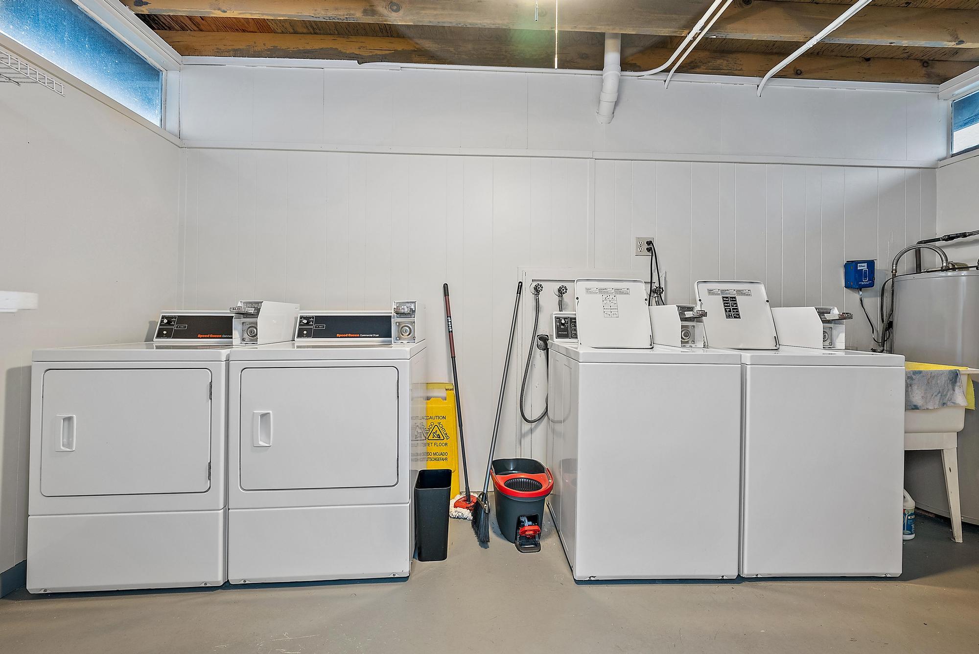 1561 Northeast 12th Terrace, Unit C14 Jensen Beach, FL 34957 - Photo 20 of 38 a utility room with dryer and washer