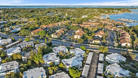 an aerial view of residential houses with outdoor space