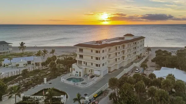 a view of a building with an ocean