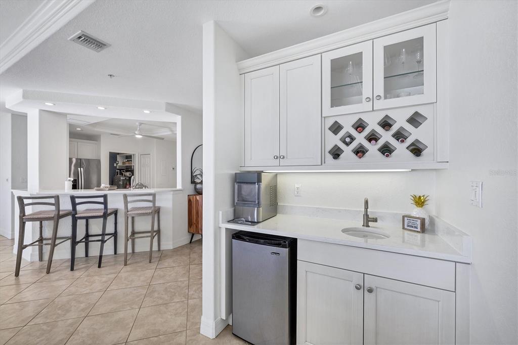 2770 North Beach Road, Unit 303 Englewood, FL 34223 - Photo 11 of 47 a kitchen with a sink and cabinets