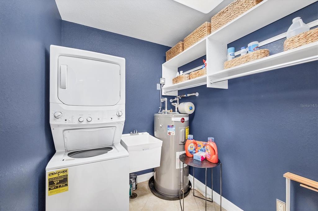 2770 North Beach Road, Unit 303 Englewood, FL 34223 - Photo 15 of 47 a utility room with dryer and washer