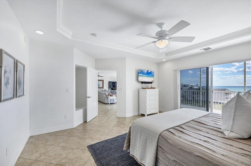 2770 North Beach Road, Unit 303 Englewood, FL 34223 - Photo 18 of 47 a bedroom with a bed ceiling fan and a window