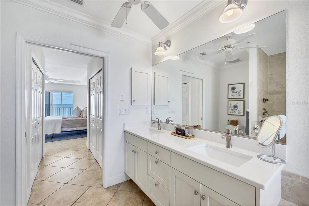 2770 North Beach Road, Unit 303 Englewood, FL 34223 - Photo 23 of 47 a en suite bathroom with a double vanity sink mirror and double