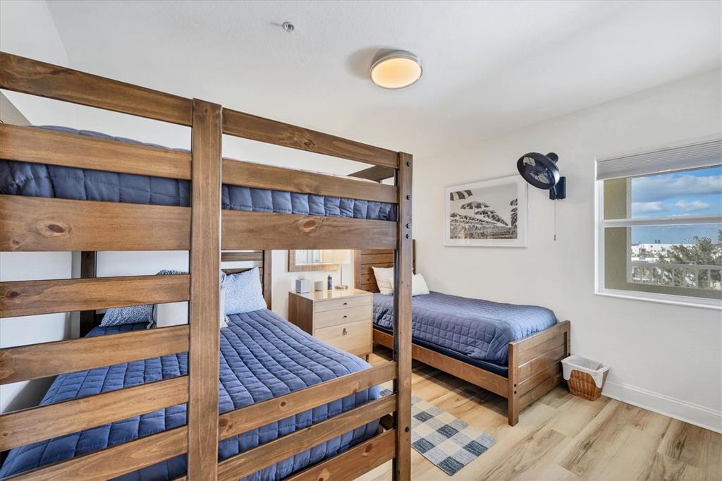 2770 North Beach Road, Unit 303 Englewood, FL 34223 - Photo 25 of 47 a bedroom with two beds and a window