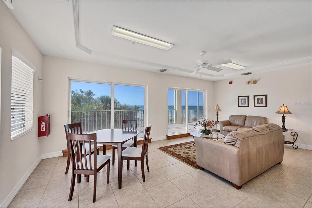 2770 North Beach Road, Unit 303 Englewood, FL 34223 - Photo 36 of 47 a living room with furniture and a large window