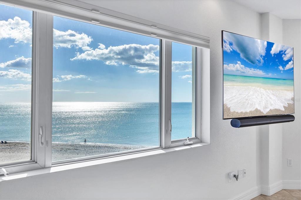 2770 North Beach Road, Unit 303 Englewood, FL 34223 - Photo 6 of 47 a view of a glass door with a glass door and a floor to ceiling window