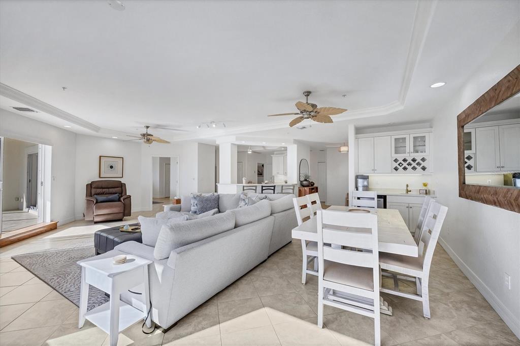 2770 North Beach Road, Unit 303 Englewood, FL 34223 - Photo 7 of 47 a living room with furniture and a chandelier