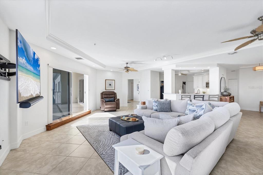 2770 North Beach Road, Unit 303 Englewood, FL 34223 - Photo 8 of 47 a living room with furniture and a fireplace