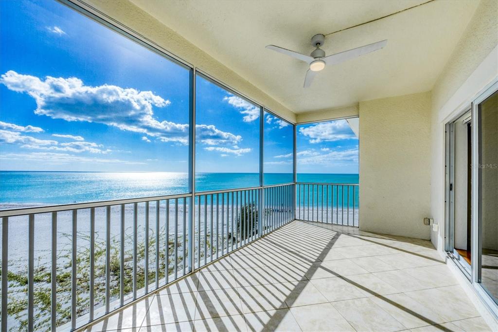 2770 North Beach Road, Unit 303 Englewood, FL 34223 - Photo 10 of 47 a balcony view with a ceiling fan