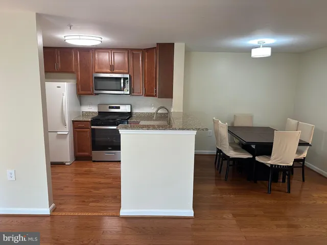 a kitchen with a sink cabinets and stainless steel appliances