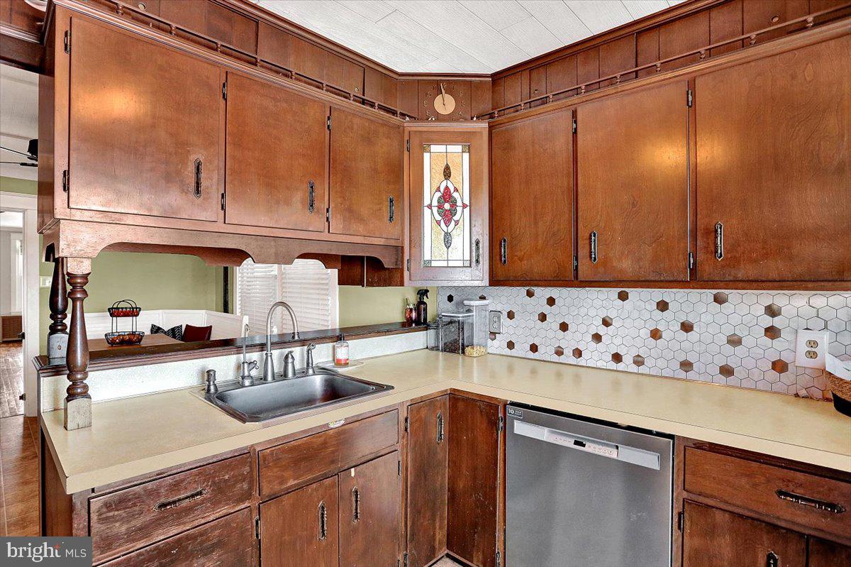 325 2nd Street Reading, PA 19607 - Photo 14 of 38 a kitchen with stainless steel appliances granite countertop a sink and cabinets