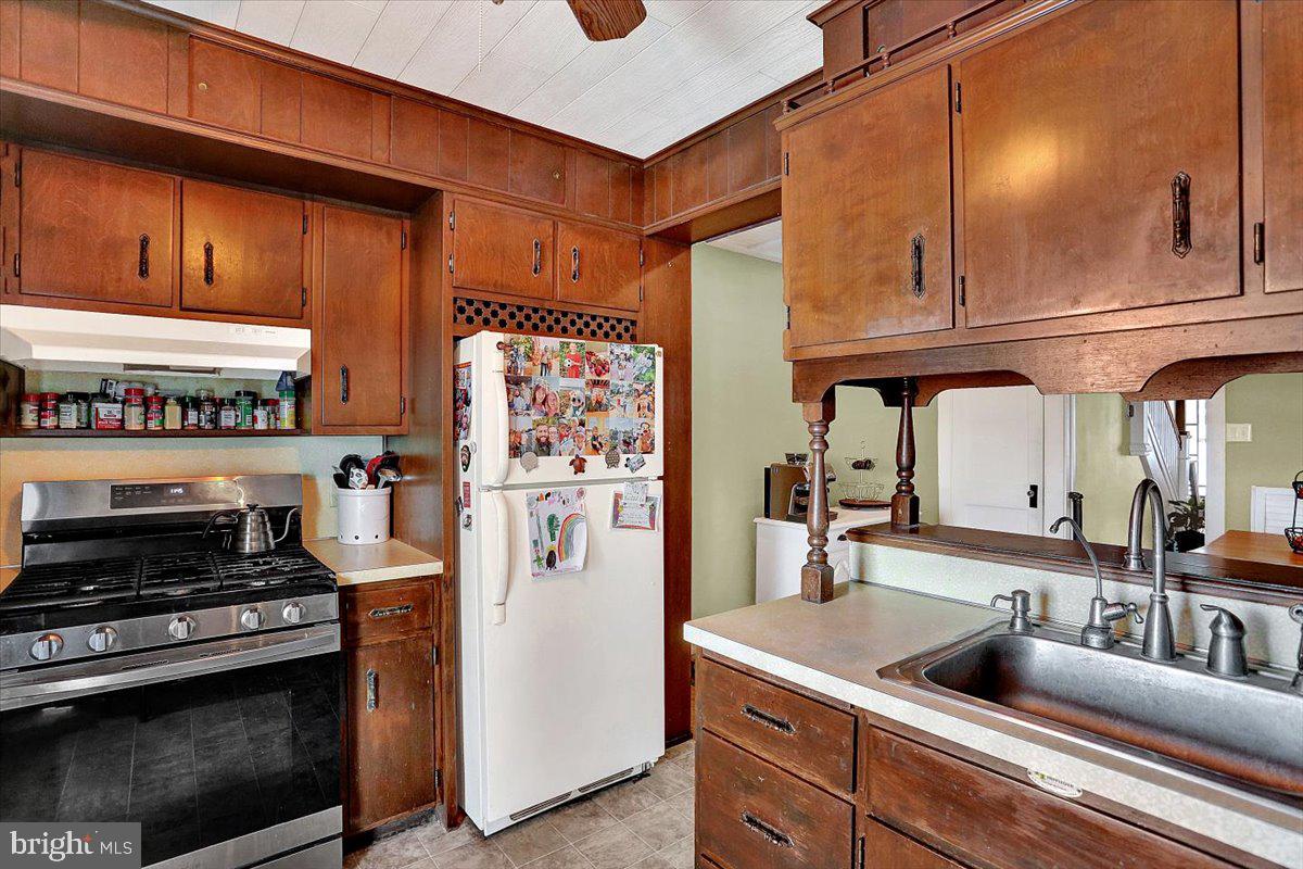 325 2nd Street Reading, PA 19607 - Photo 15 of 38 a kitchen with stainless steel appliances granite countertop a refrigerator and a stove top oven