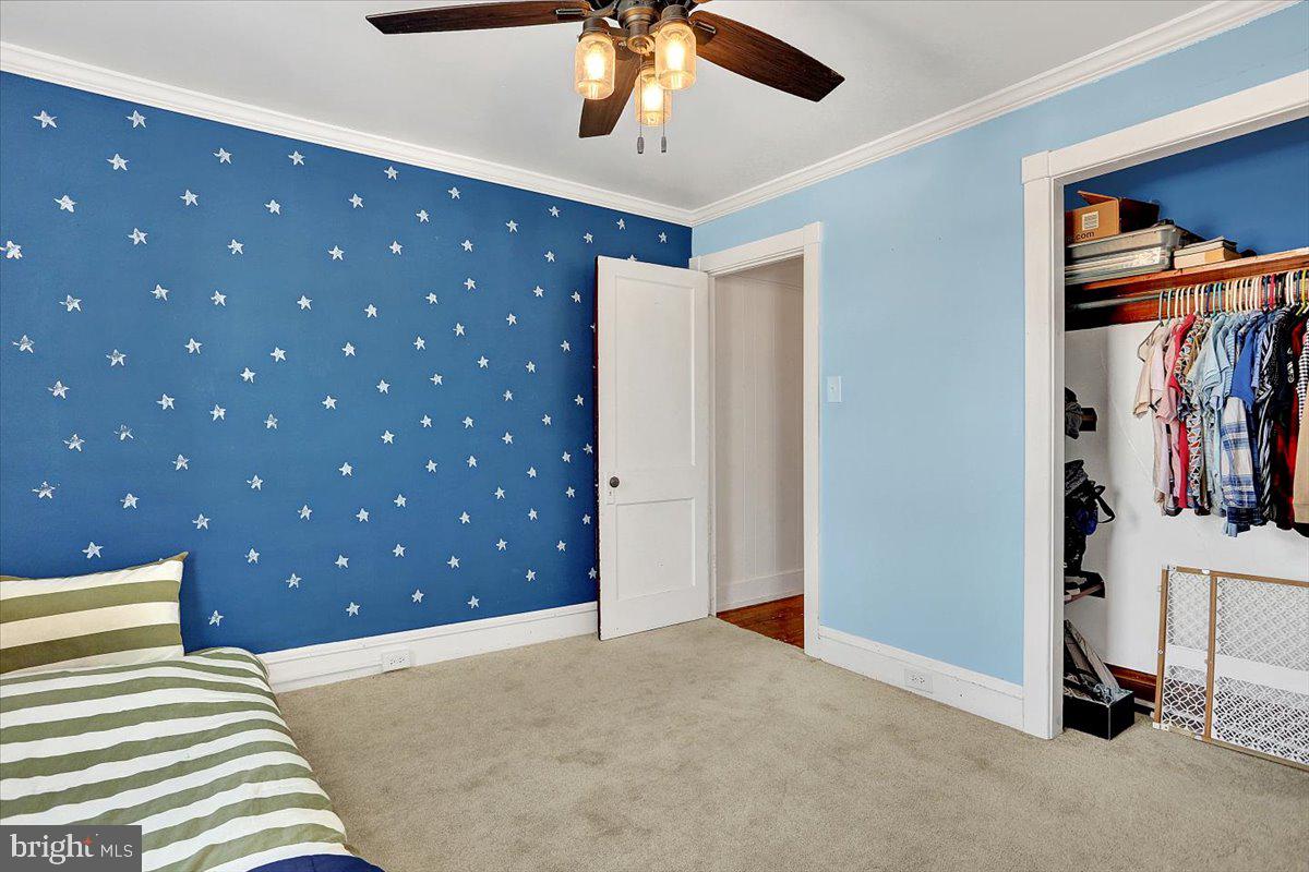 325 2nd Street Reading, PA 19607 - Photo 23 of 38 a bedroom with a bed and a chandelier