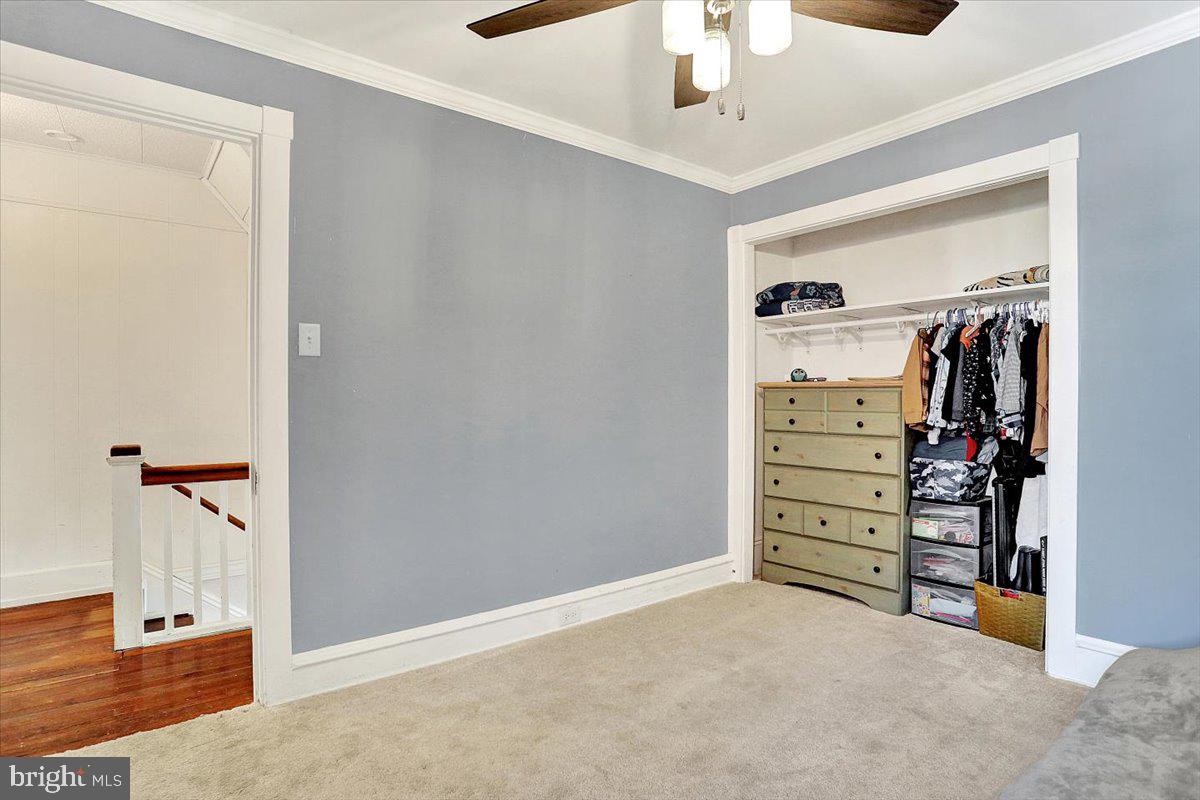 325 2nd Street Reading, PA 19607 - Photo 25 of 38 an empty room with closet and a ceiling fan