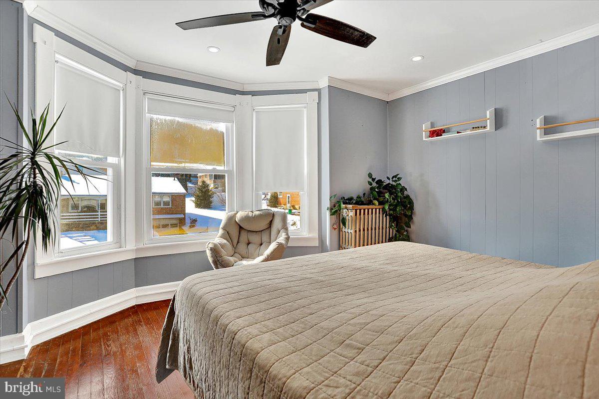 325 2nd Street Reading, PA 19607 - Photo 27 of 38 a bedroom with a bed and a large window