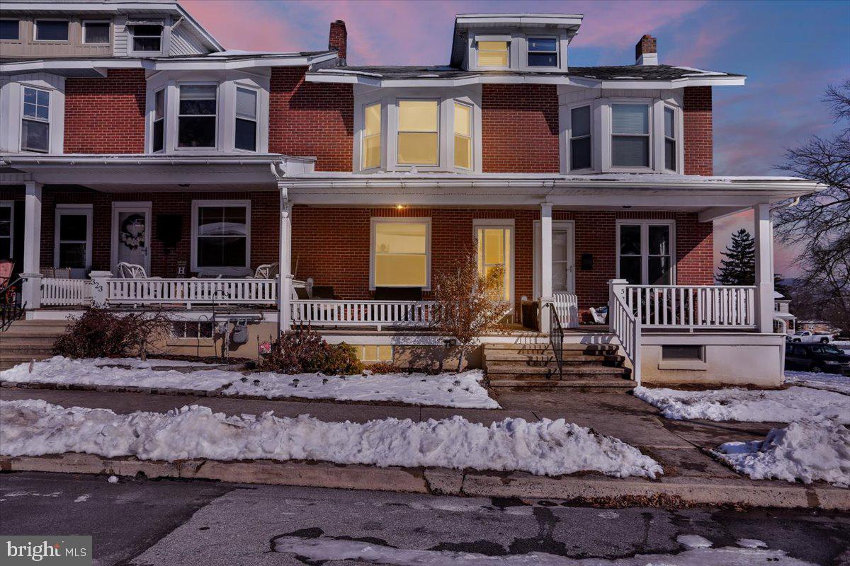 325 2nd Street Reading, PA 19607 - Photo 3 of 38 a front view of a house with a yard