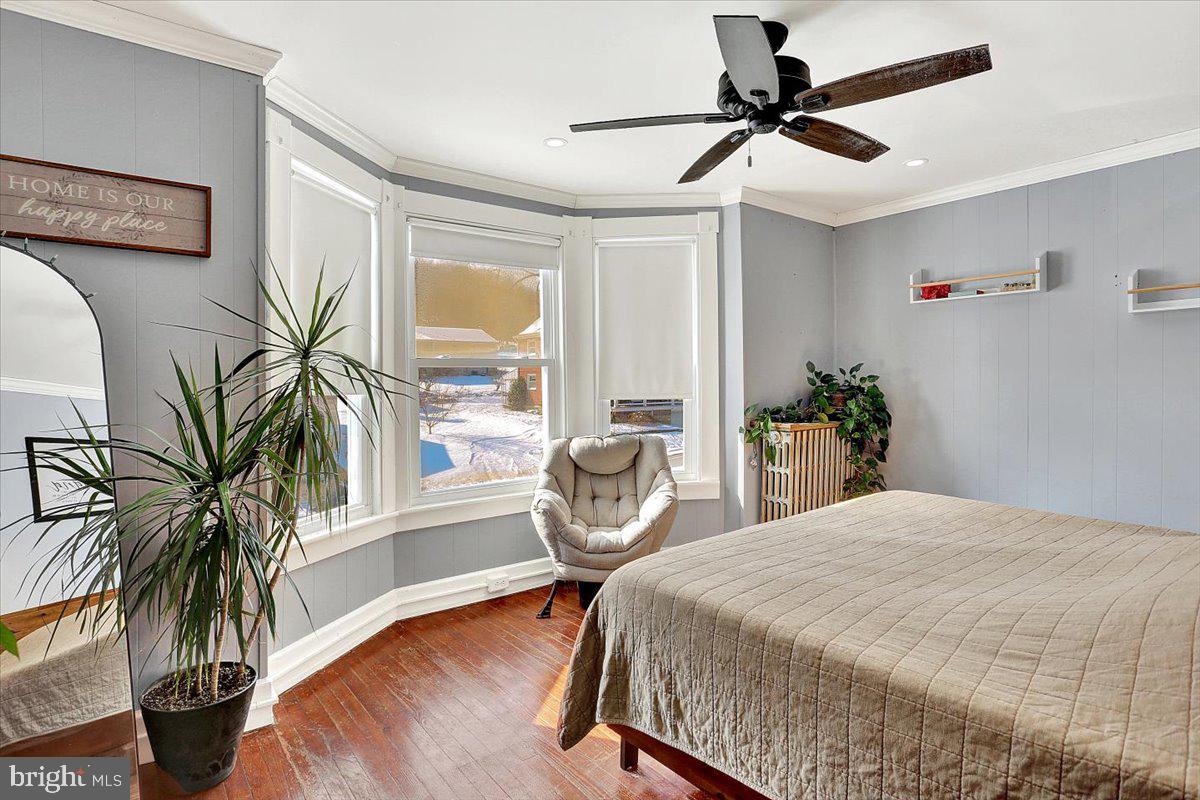 325 2nd Street Reading, PA 19607 - Photo 31 of 38 a bedroom with a bed and a potted plant