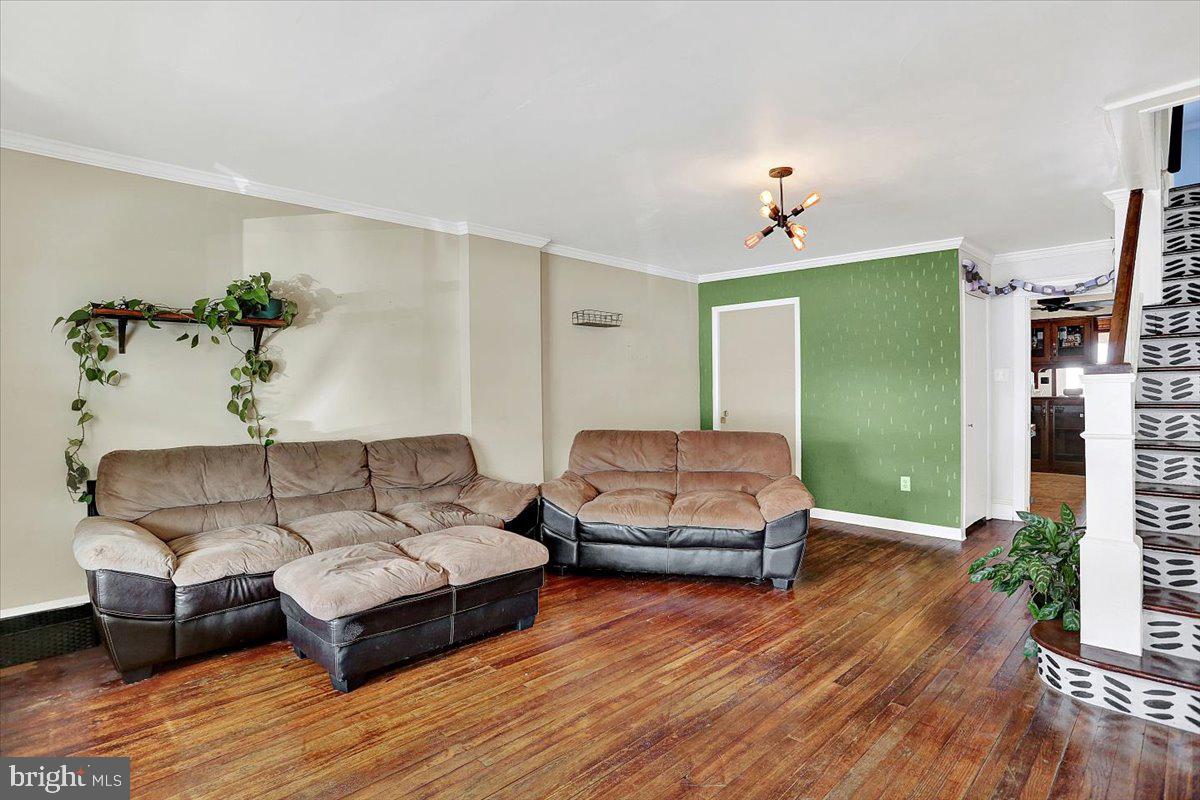 325 2nd Street Reading, PA 19607 - Photo 6 of 38 a living room with furniture and a wooden floor