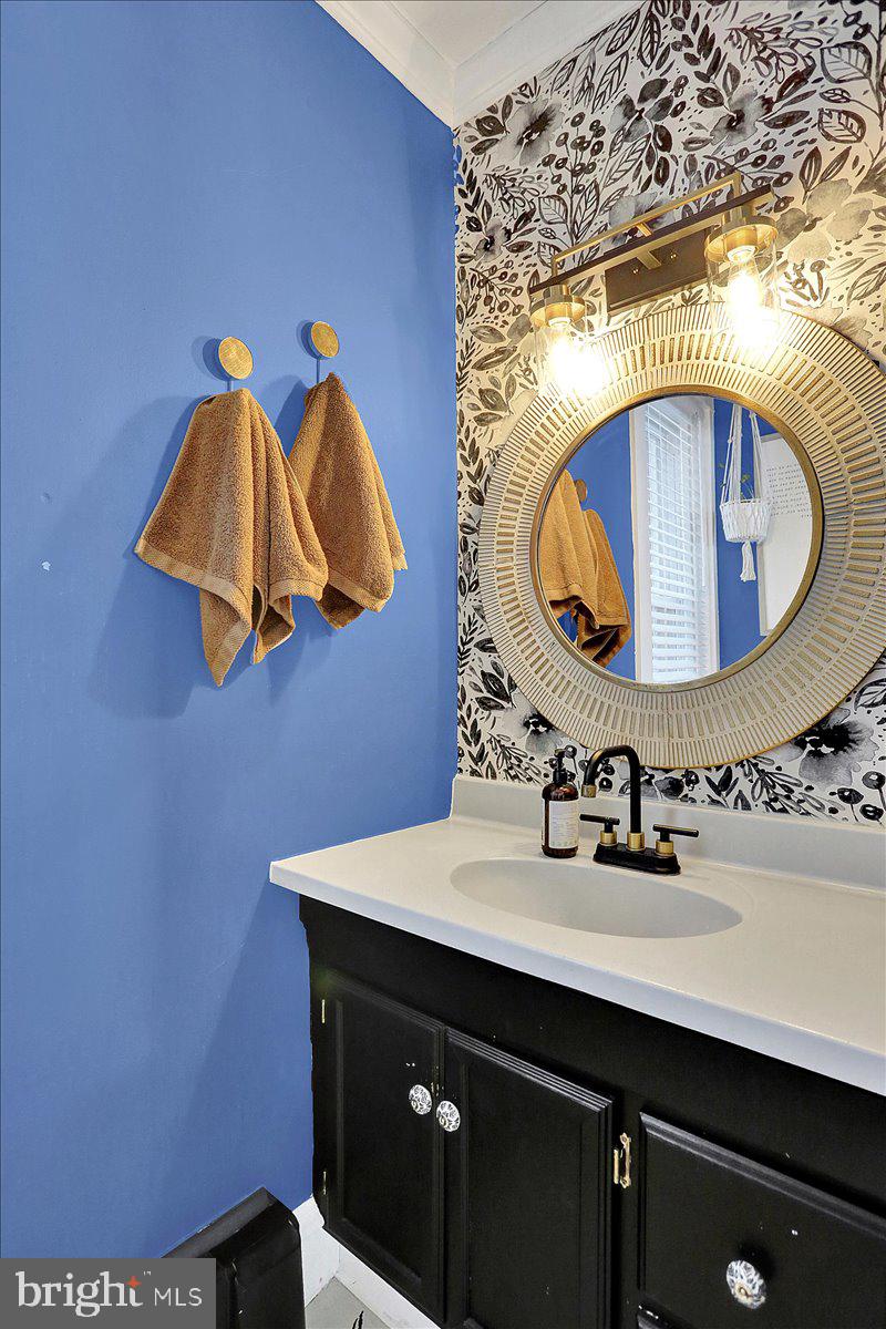 325 2nd Street Reading, PA 19607 - Photo 10 of 38 a bathroom with a sink and mirror