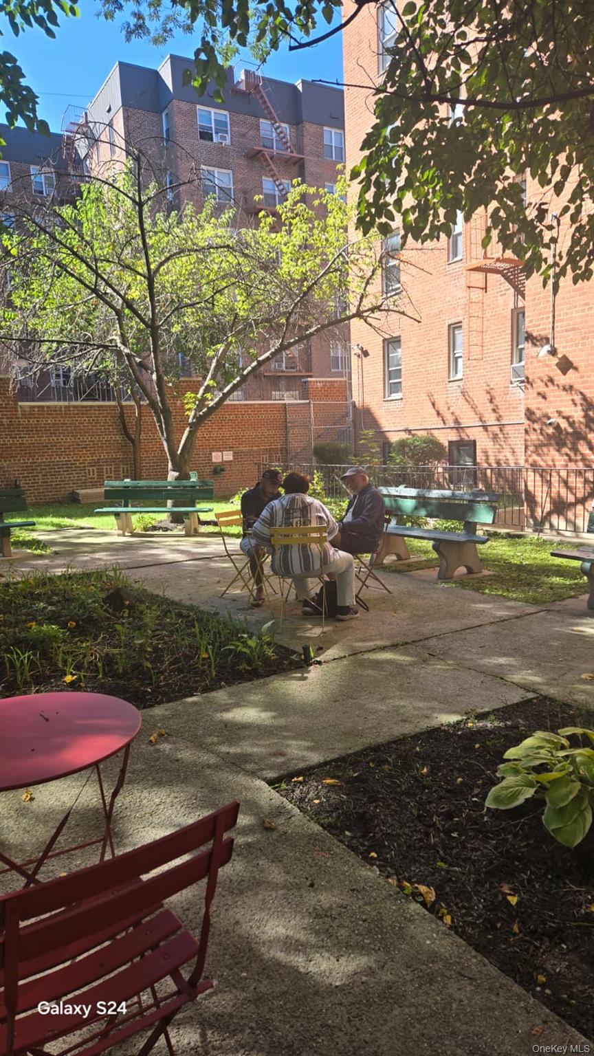 33-16 82nd Street, Unit 6D Queens, NY 11372 - Photo 16 of 16 View of community with a patio