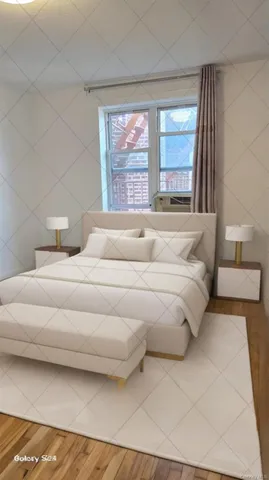 a bedroom with a large bed and a large window