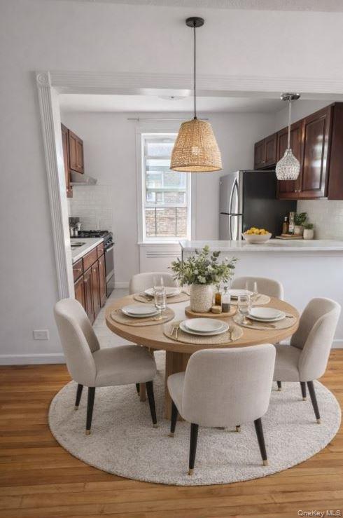 33-16 82nd Street, Unit 6D Queens, NY 11372 - Photo 6 of 16 Dining area with light wood finished floors