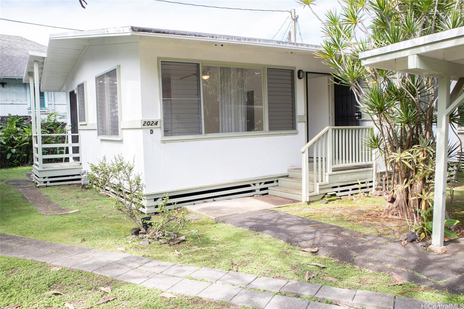 2024 Ohai Lane, Unit D Honolulu, HI 96813 - Photo 1 of 11 a view of a house with a tree in the background