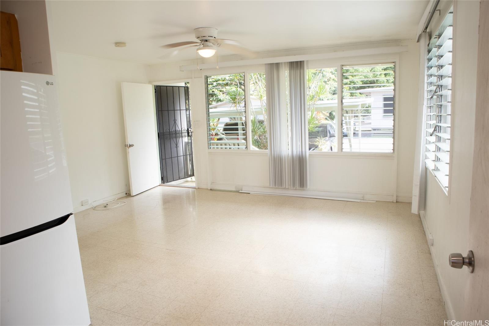 2024 Ohai Lane, Unit D Honolulu, HI 96813 - Photo 5 of 11 a view of an empty room with a window