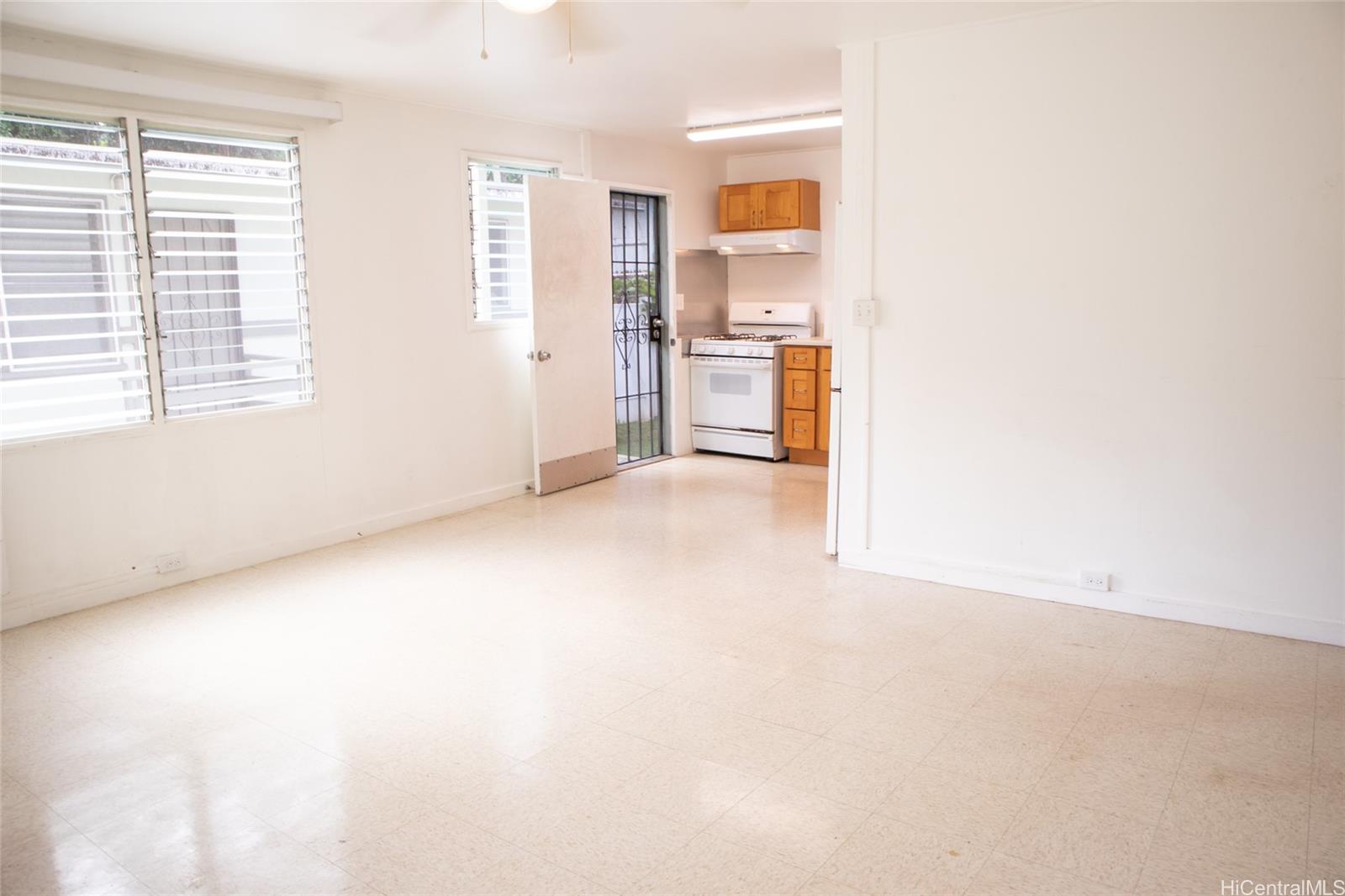 2024 Ohai Lane, Unit D Honolulu, HI 96813 - Photo 7 of 11 a view of a kitchen with a sink cabinet and a window