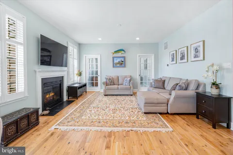 a living room with furniture fireplace and a flat screen tv