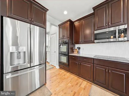 a kitchen with stainless steel appliances lots of counter top space
