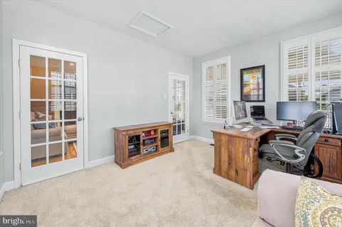 a living room with furniture and windows
