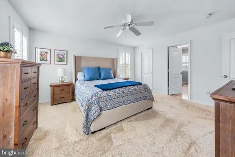 a view of walk in closet with clothes