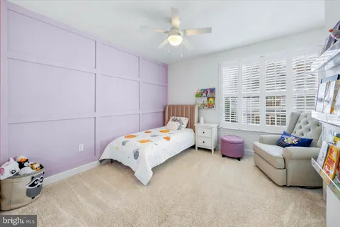 a bedroom with a bed and a tv