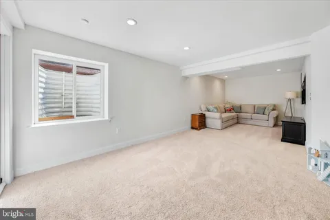 a balcony with furniture and wooden floor