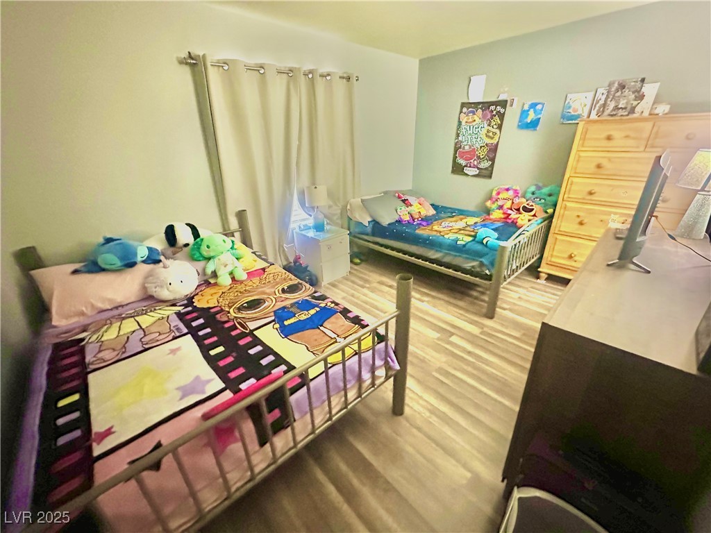 2016 Mesquite Lane, Unit 302 Laughlin, NV 89029 - Photo 19 of 27 Bedroom with wood finished floors