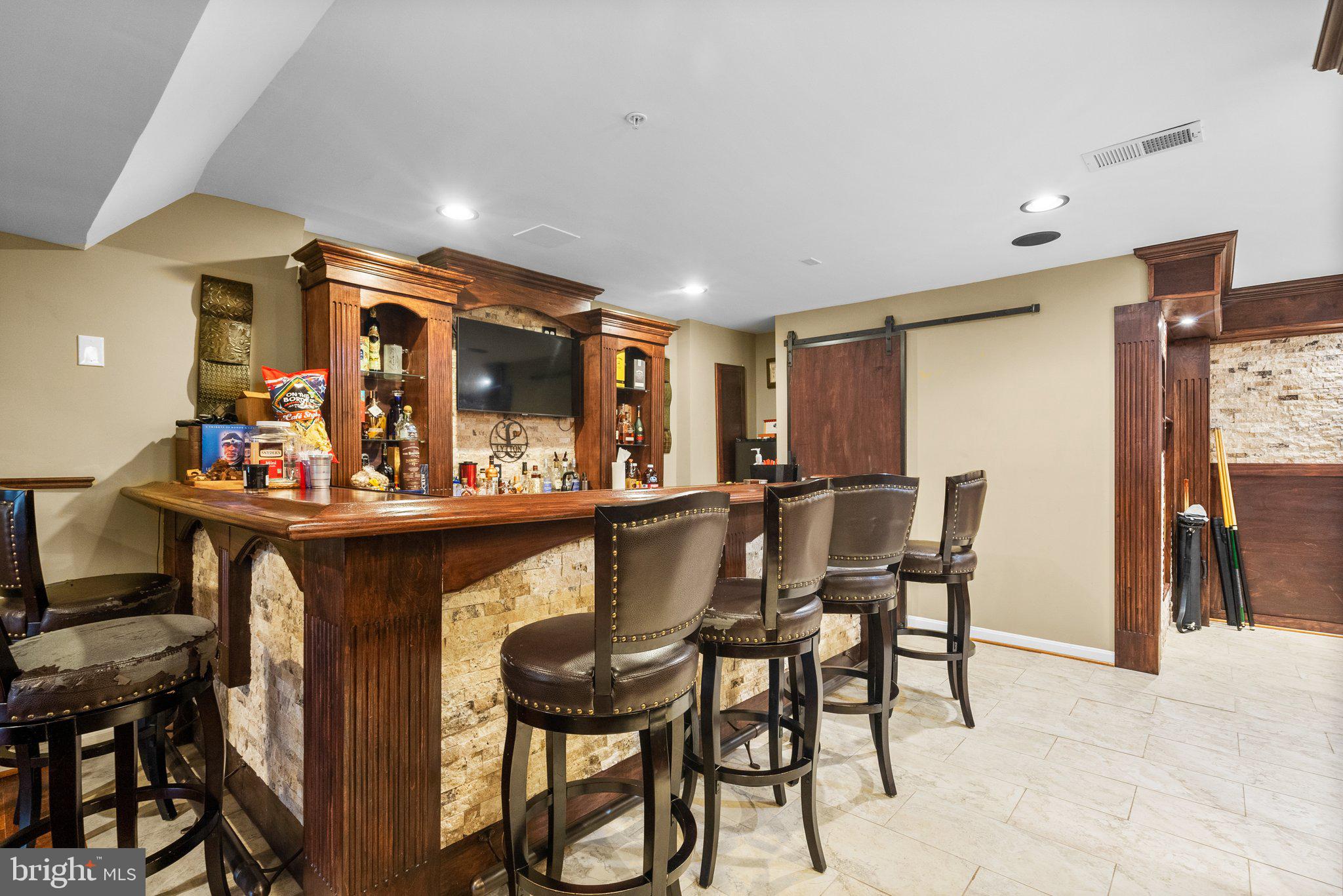 17510 Madrillon Way Accokeek, MD 20607 - Photo 22 of 40 Lower level grand bar