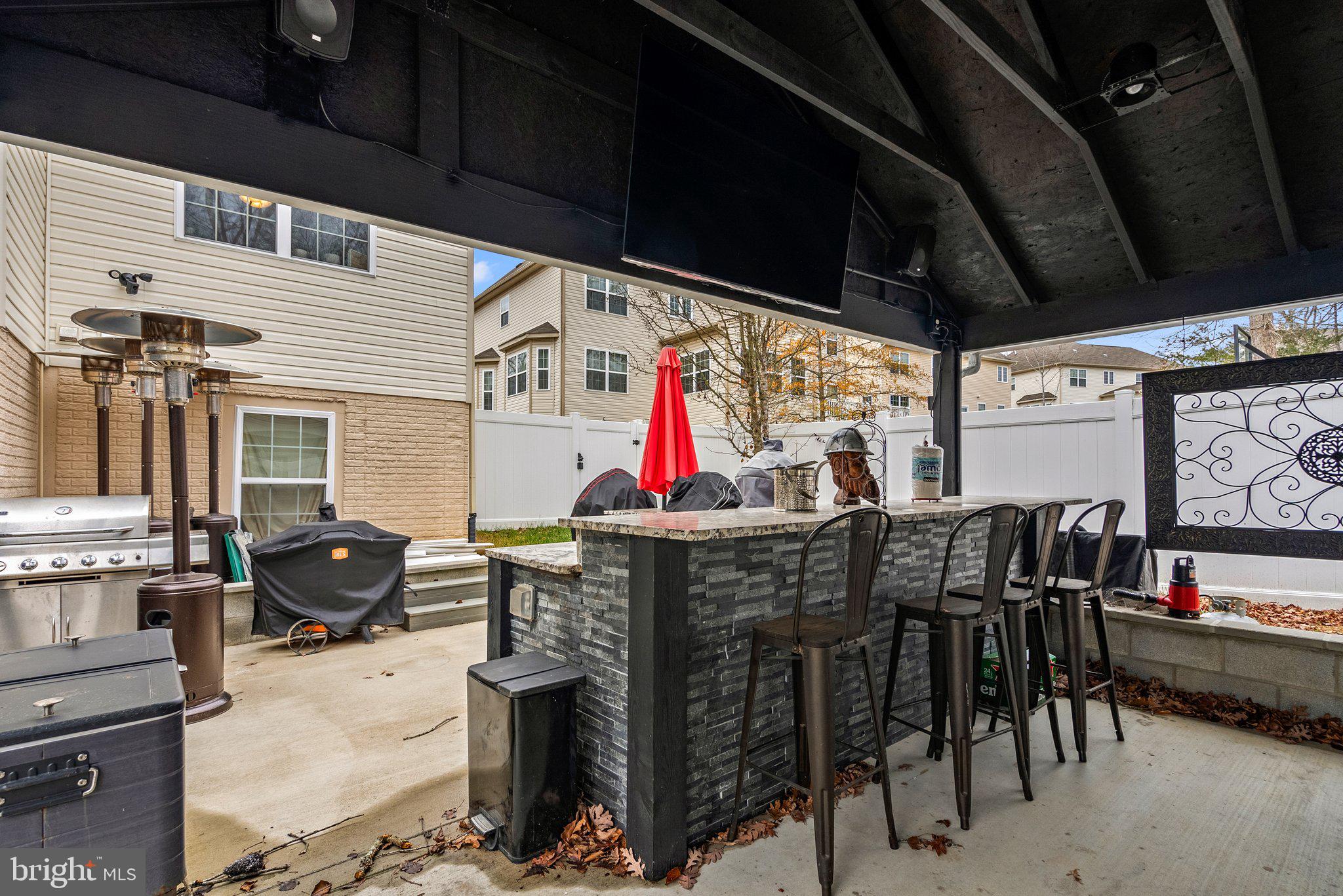 17510 Madrillon Way Accokeek, MD 20607 - Photo 28 of 40 Covered patio bar & outdoor kitchen