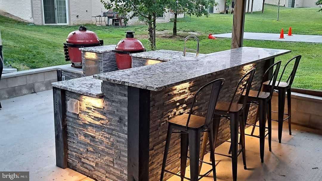 17510 Madrillon Way Accokeek, MD 20607 - Photo 29 of 40 Outdoor patio bar w/ kitchen