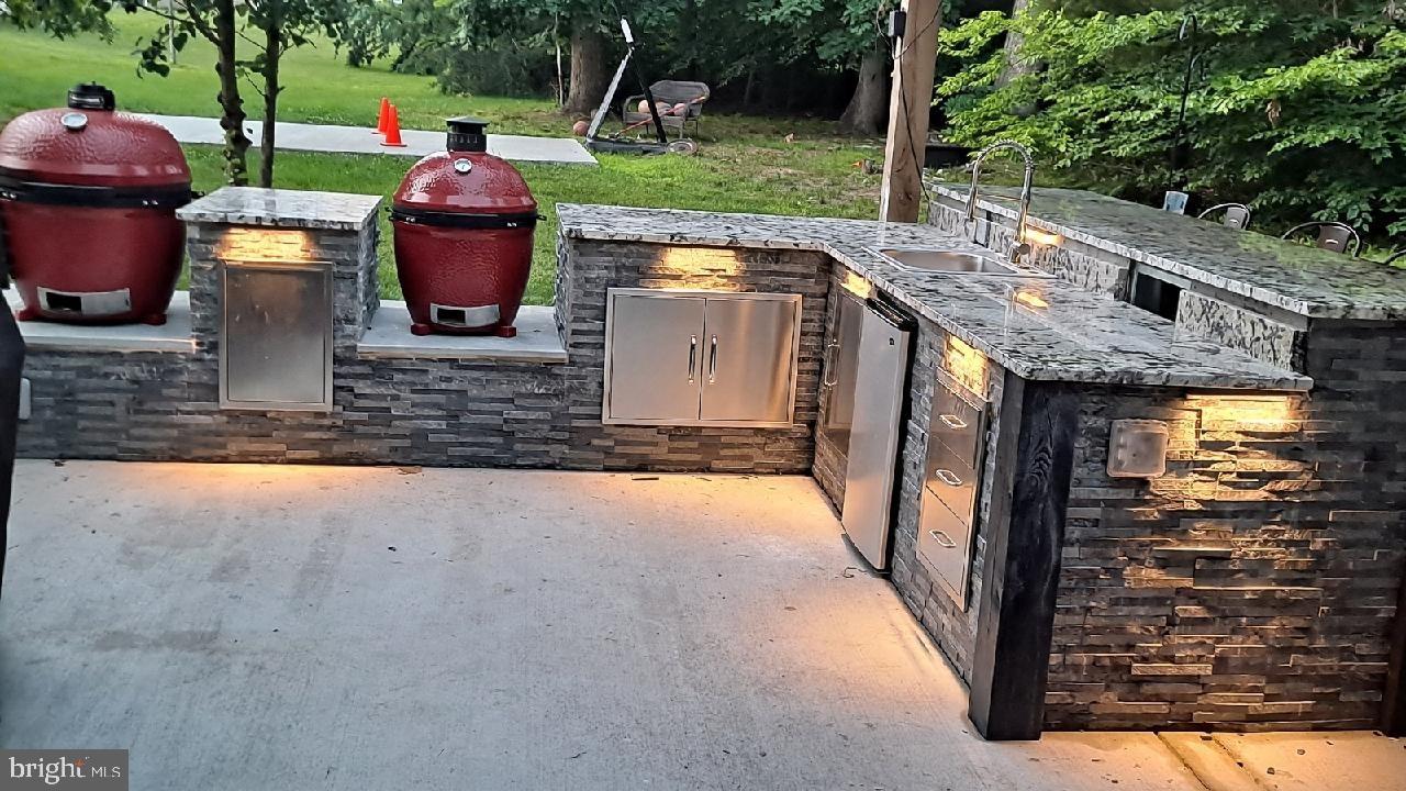 17510 Madrillon Way Accokeek, MD 20607 - Photo 31 of 40 Complete outdoor kitchen & bar