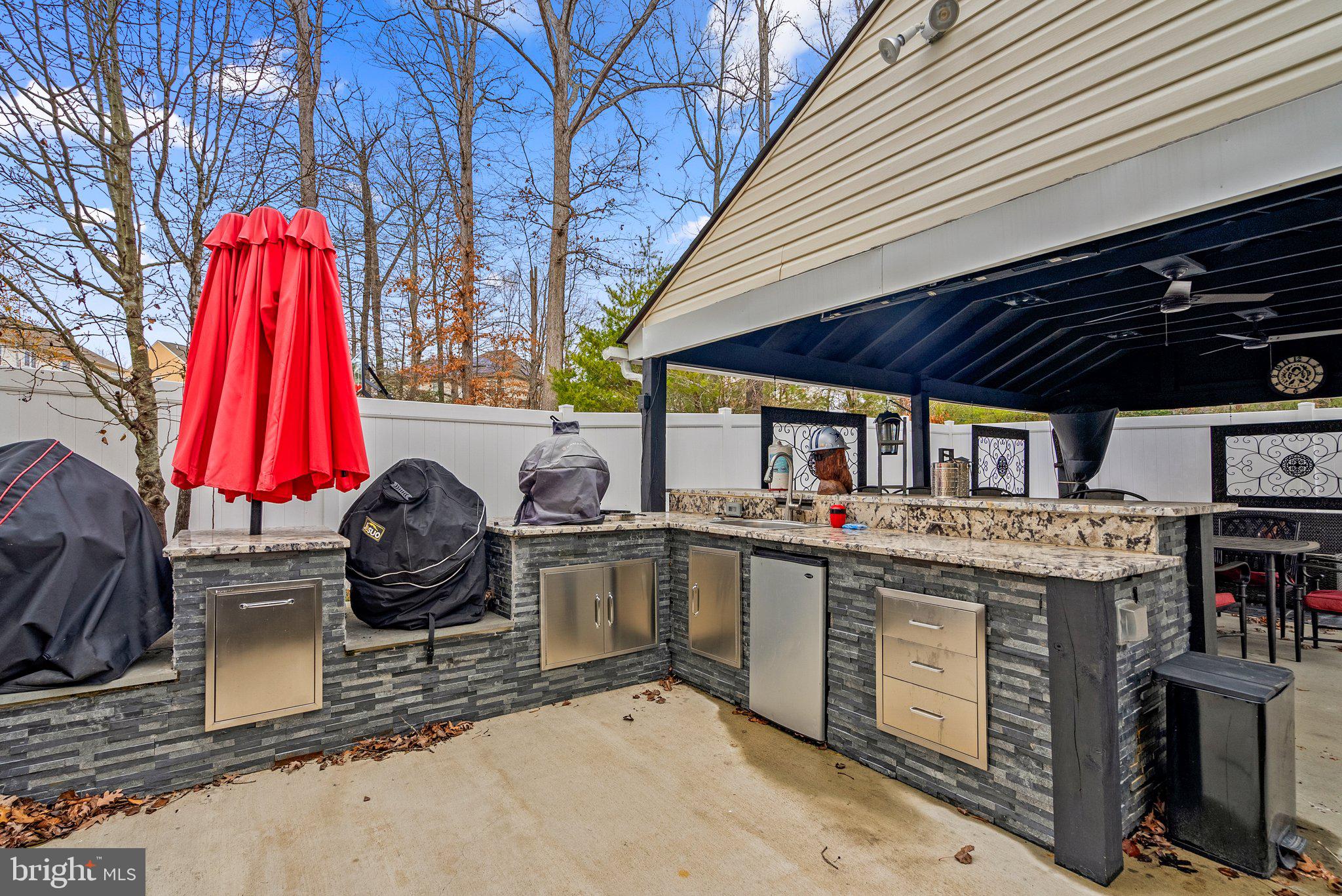 17510 Madrillon Way Accokeek, MD 20607 - Photo 36 of 40 Patio grills, smoker, frig, sink, warming drawers
